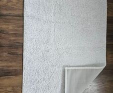 White floor mat with rubber backing