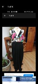 Ladies Jumpsuit black with flowel detail on the top.