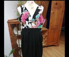 Ladies Jumpsuit black with flowel detail on the top.