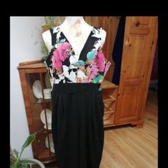 Ladies Jumpsuit black with flowel detail on the top.