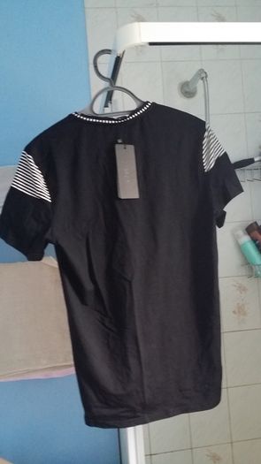 BNWT Casual black with some strips details top