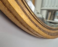 Antique oval mirror bevelled.