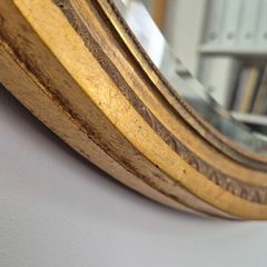 Antique oval mirror bevelled.