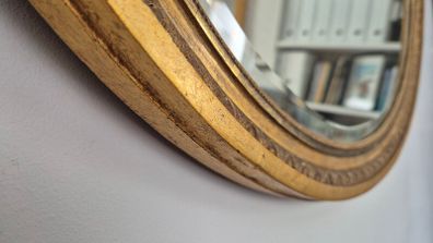 Antique oval mirror bevelled.