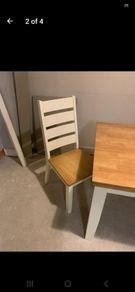 Oak and cream table and four chairs.