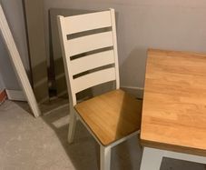 Oak and cream table and four chairs.