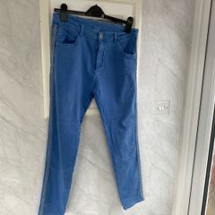 Ladies blue jeans with side embellishments