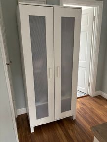 White wardrobe with hanging storage shelves
