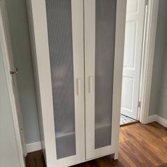 White wardrobe with hanging storage shelves