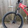 Rockrider ST 900. 24in wheels, mechanical disc brakes, front suspension forks, 8 gears. In good working order with the usual scrapes and scratches from kid use. Image 5