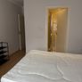 Room with double bed and attached washroom Image 5