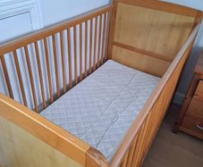 Cot including mattress and protective cover
