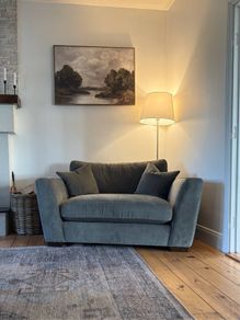 Green snuggler sofa