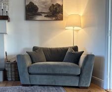 Green snuggler sofa