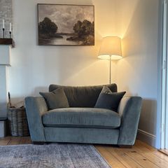 Green snuggler sofa