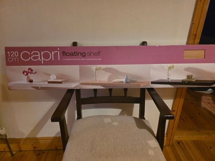 Capri 120cm floating wall shelf in a light oak-effect finish.