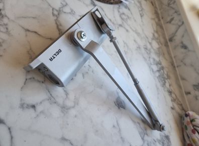 Delta door closer