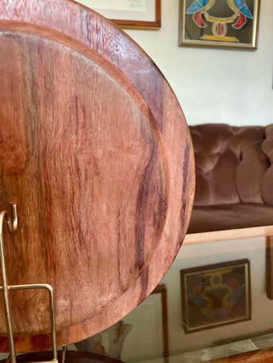 Beautiful vintage hand-carved wooden tray featuring an intricate floral border and a decorative brass inlay geometric star motif in the centre. The craftsmanship is detailed and very tactile, giving this piece a rich, warm character. The tray is solid and