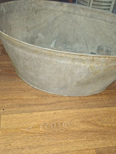 A Beautiful Large Old Galvanized Steel Wash Tub with Side Handles in nice used condition and is frequently used for Farmhouse Decor or Garden