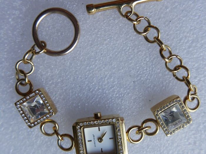 Pieces gold tone bracelet watch with crystal detail