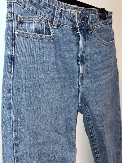 Distressed blue jeans
