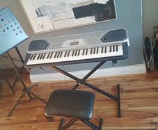 Casio keyboard with stand, stool and music holder