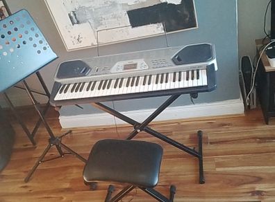 Casio keyboard with stand, stool and music holder
