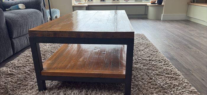 Industrial style coffee table with lower shelf