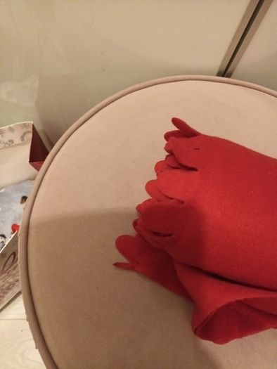 Red throw with scalloped edges
