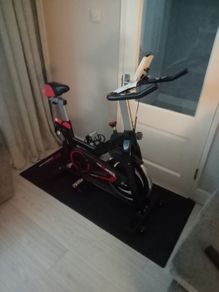 Speed exercise bike with floor mat