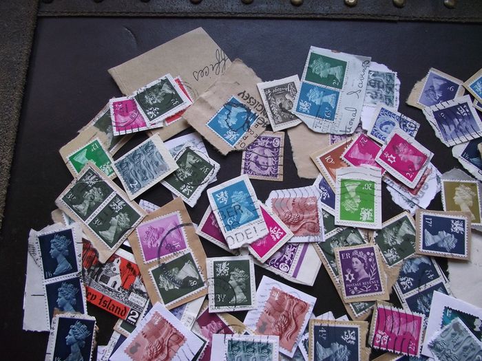 A box with collection of stamps from Great Britain