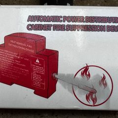 Automatic aerosol cabinet fire suppression device