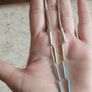 Silver tone chain earrings. Image 2