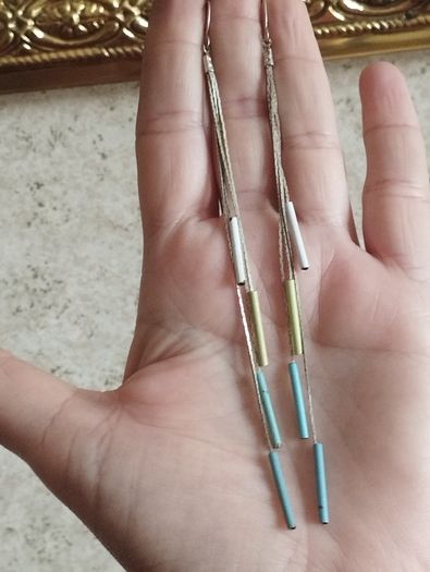 Silver tone chain earrings.