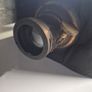 The object in the image is a vintage antique camera Image 10