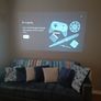 philips neopix ultra 2tv+ home projector and height adjustable stand, built in speakers and android TV with play store stand comes with power point bracket on it as seen in pictures also remote and phone holder Image 8