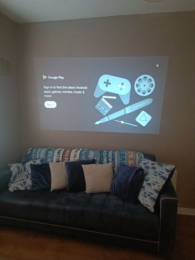 philips neopix ultra 2tv+ home projector and height adjustable stand, built in speakers and android TV with play store stand comes with power point bracket on it as seen in pictures also remote and phone holder