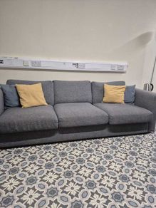 Must go. Grey three-seater fabric couch.