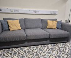 Must go. Grey three-seater fabric couch.