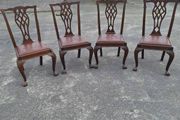 A set of four pierced Chippendale style chairs