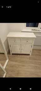 Cabinet. White Cabinet With Crystal Handles. 42 Inches High, 35 Inches Across And 18 Inches Deep.