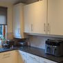 Kitchen with black granite worktop Image 2