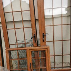 Solid 15 panel Oak doors, frame and window for sale