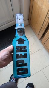 Hanging bottle opener