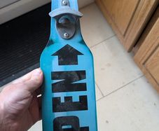Hanging bottle opener