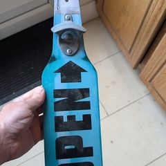 Hanging bottle opener