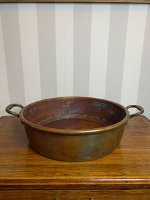 Beautiful large antique solid copper flat-bottom pan with riveted brass handles.