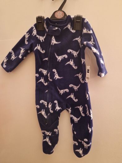 A selection of brand new baby clothes and items