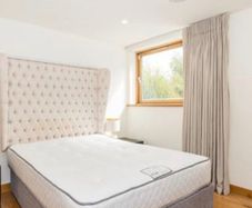Designer headboard with linen upholstery