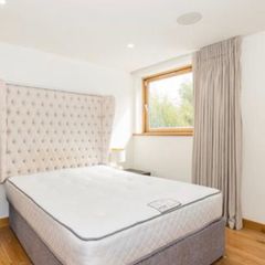 Designer headboard with linen upholstery